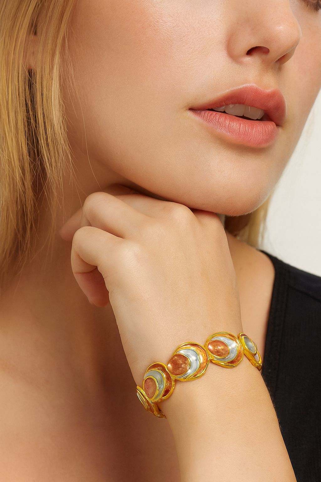 Model wearing hand-painted enamel KC gold bangle – wrist closeup