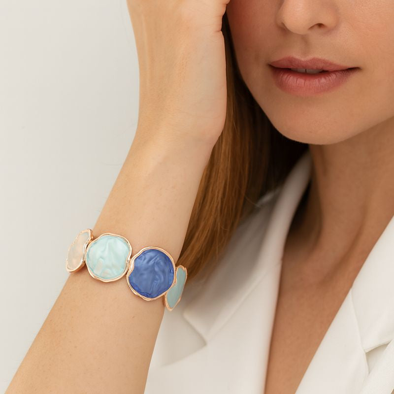 Close-up of colorful enamel swirl bracelet for women