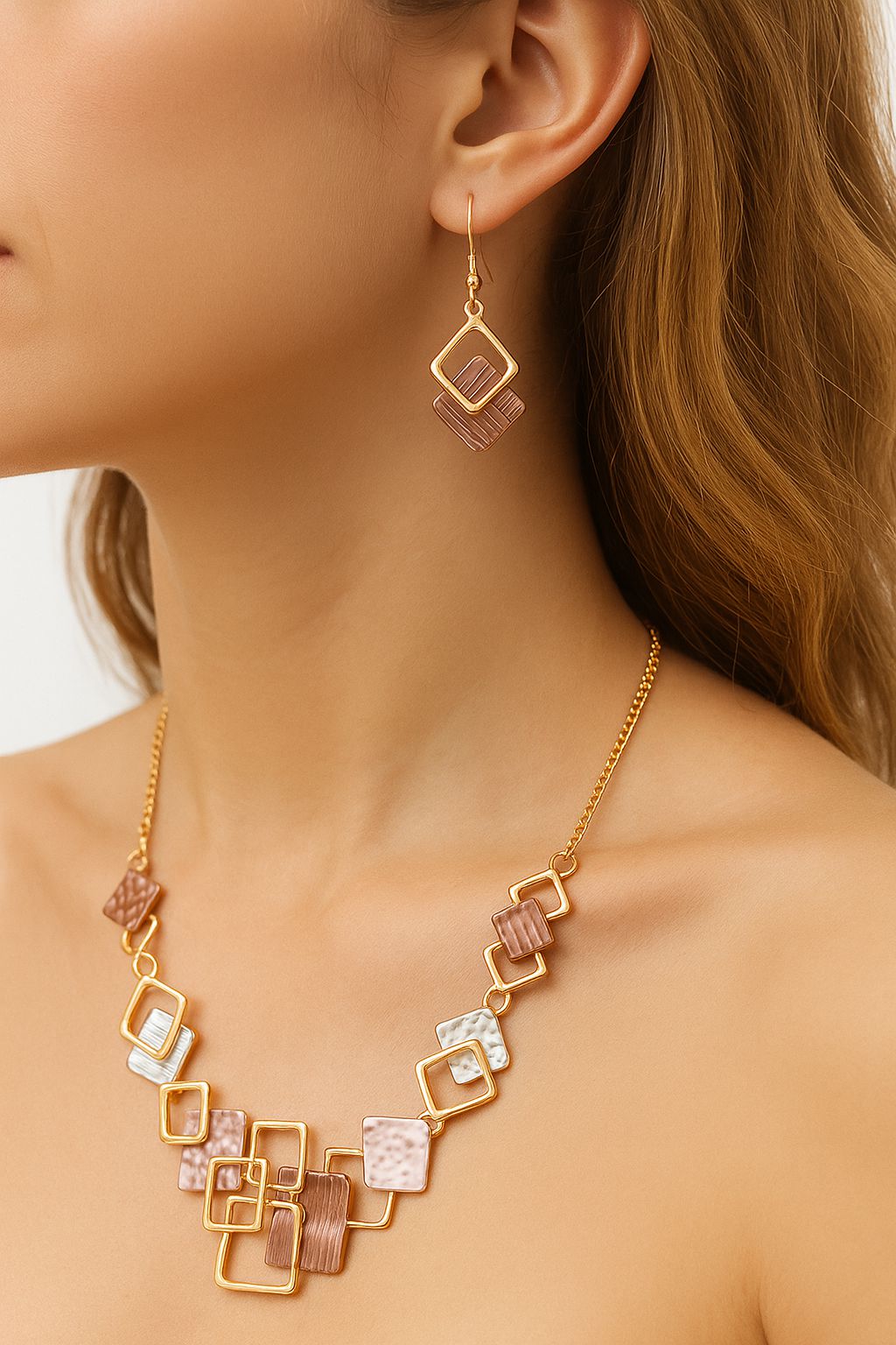 Gold plated square drop earrings close up view