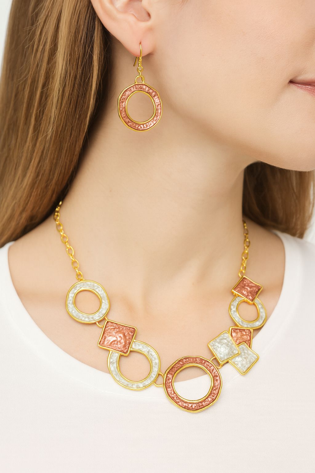 Gold geometric dangle earrings with artisan finish