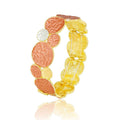 Side view of hand-painted KC gold plated textured oval bracelet