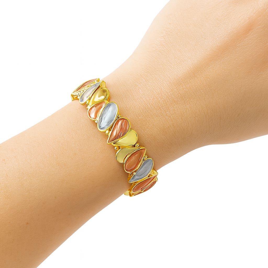 Model wearing multicolor KC gold teardrop bangle bracelet