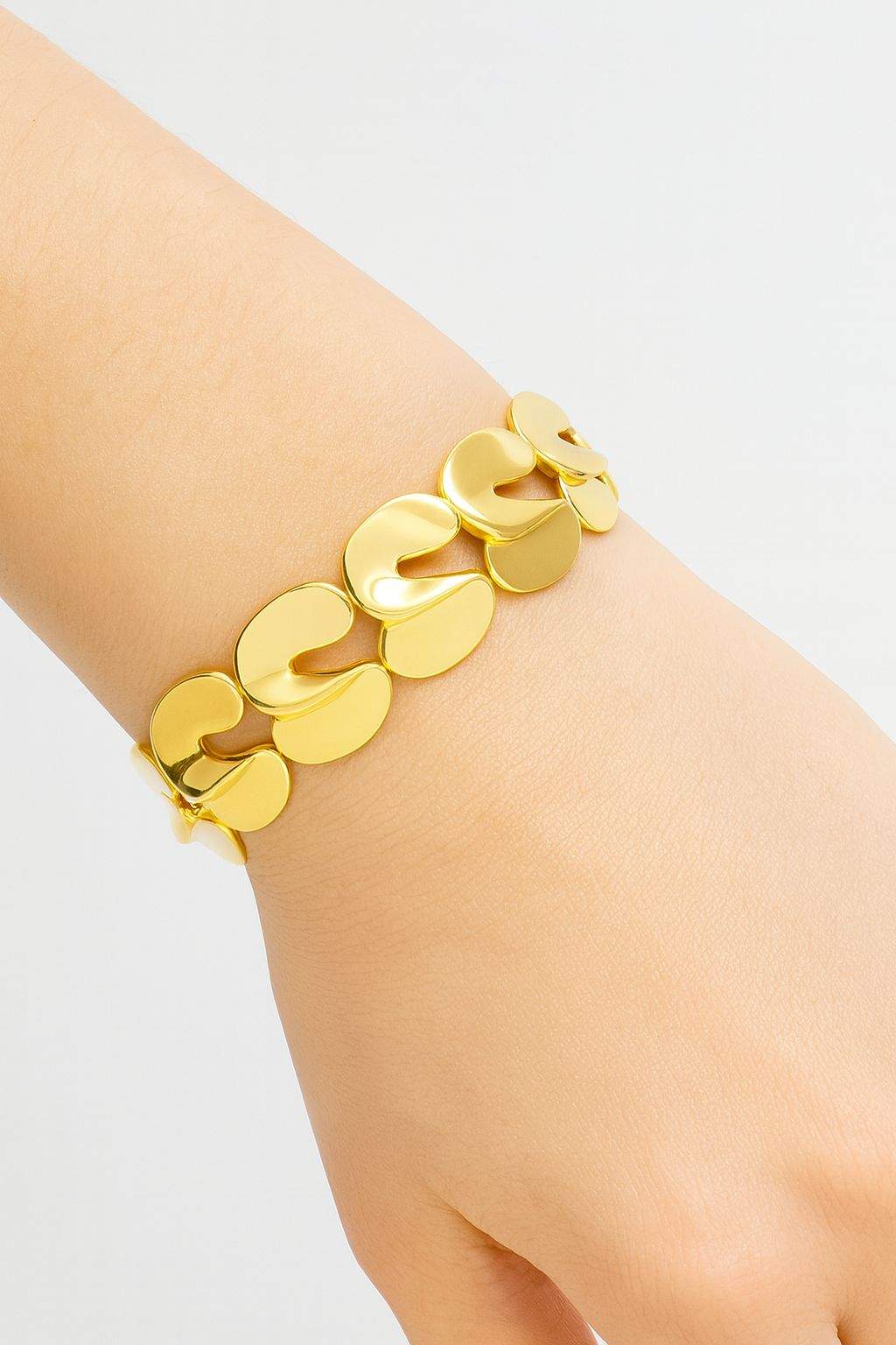 Minimalist gold link bracelet on model