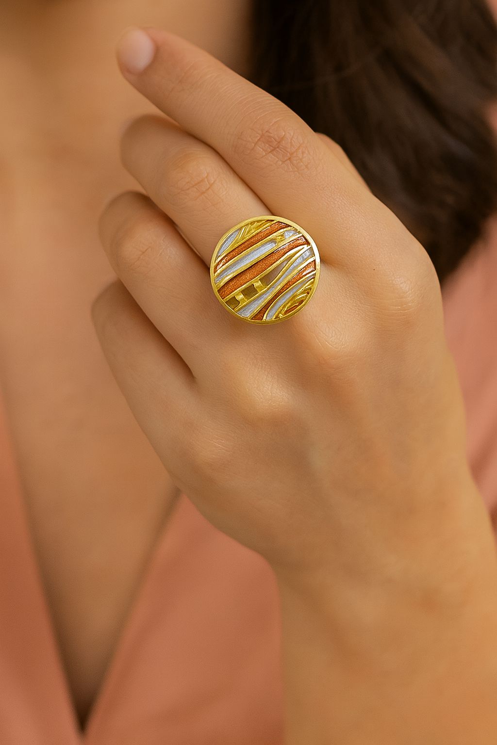 Model wearing modern abstract KC gold plated enamel ring