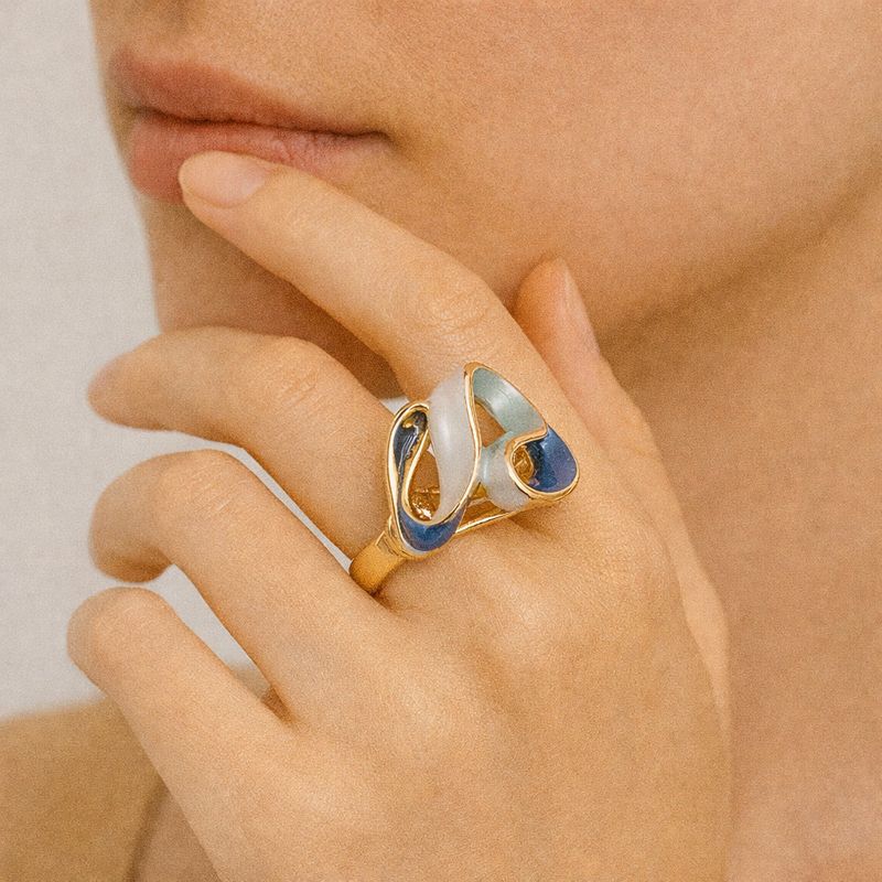 Modern abstract enamel ring worn on hand showcasing bold artistic design