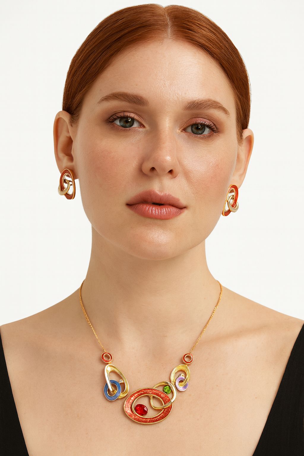 Abstract geometric necklace and earrings with hand-painted enamel worn by model