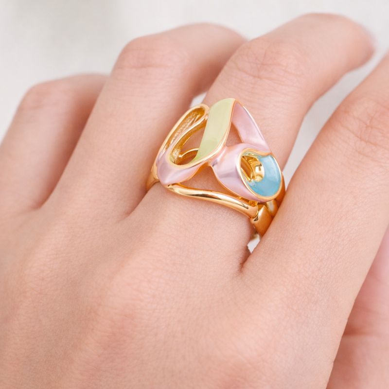 Abstract hand painted enamel gold ring worn on hand with modern sculptural design