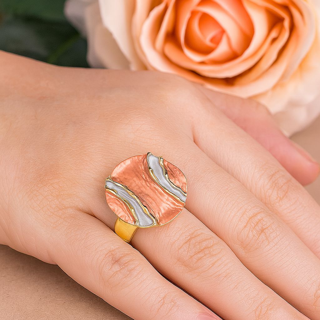 Close-up detail of abstract enamel gold fashion ring