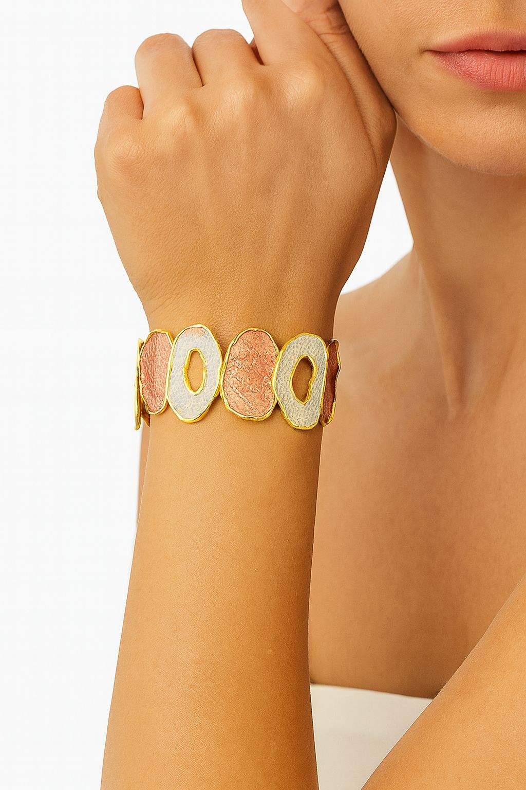 Detail close-up of the abstract pattern and hand-painted enamel