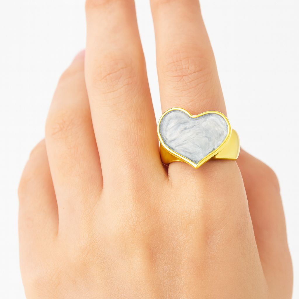 Woman wearing adjustable heart statement ring