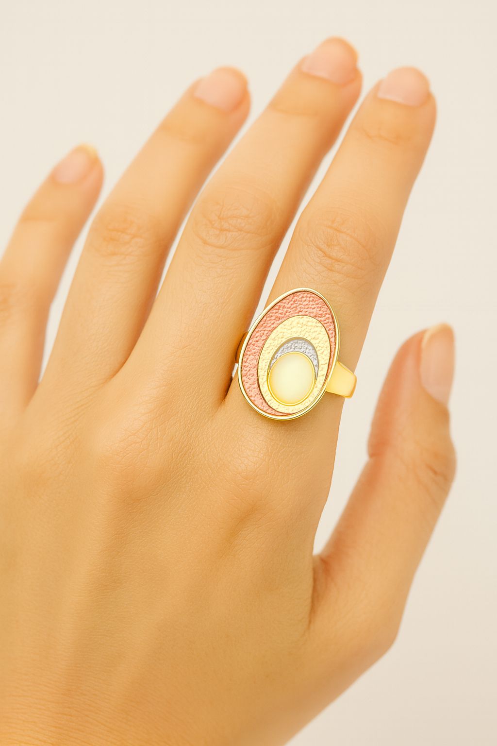 “Adjustable gold plated ring worn on hand model”