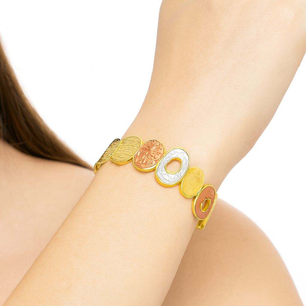 KC gold plated multi-tone textured oval open circle bracelet on wrist
