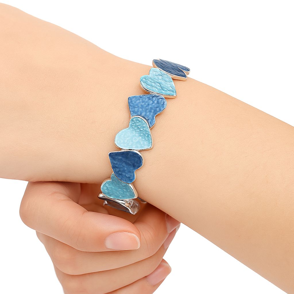 Artisan heart bracelet styled on model wrist