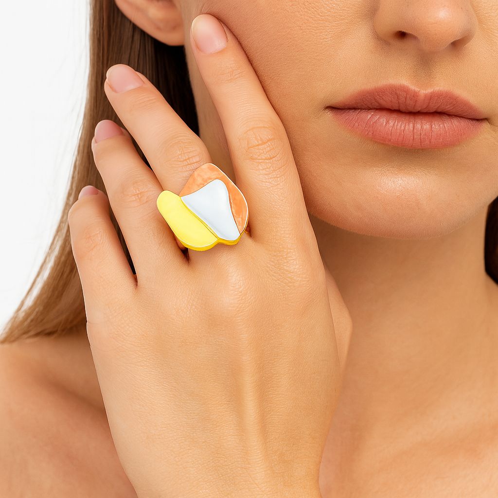 Abstract artistic gold ring featuring white, peach and yellow enamel details