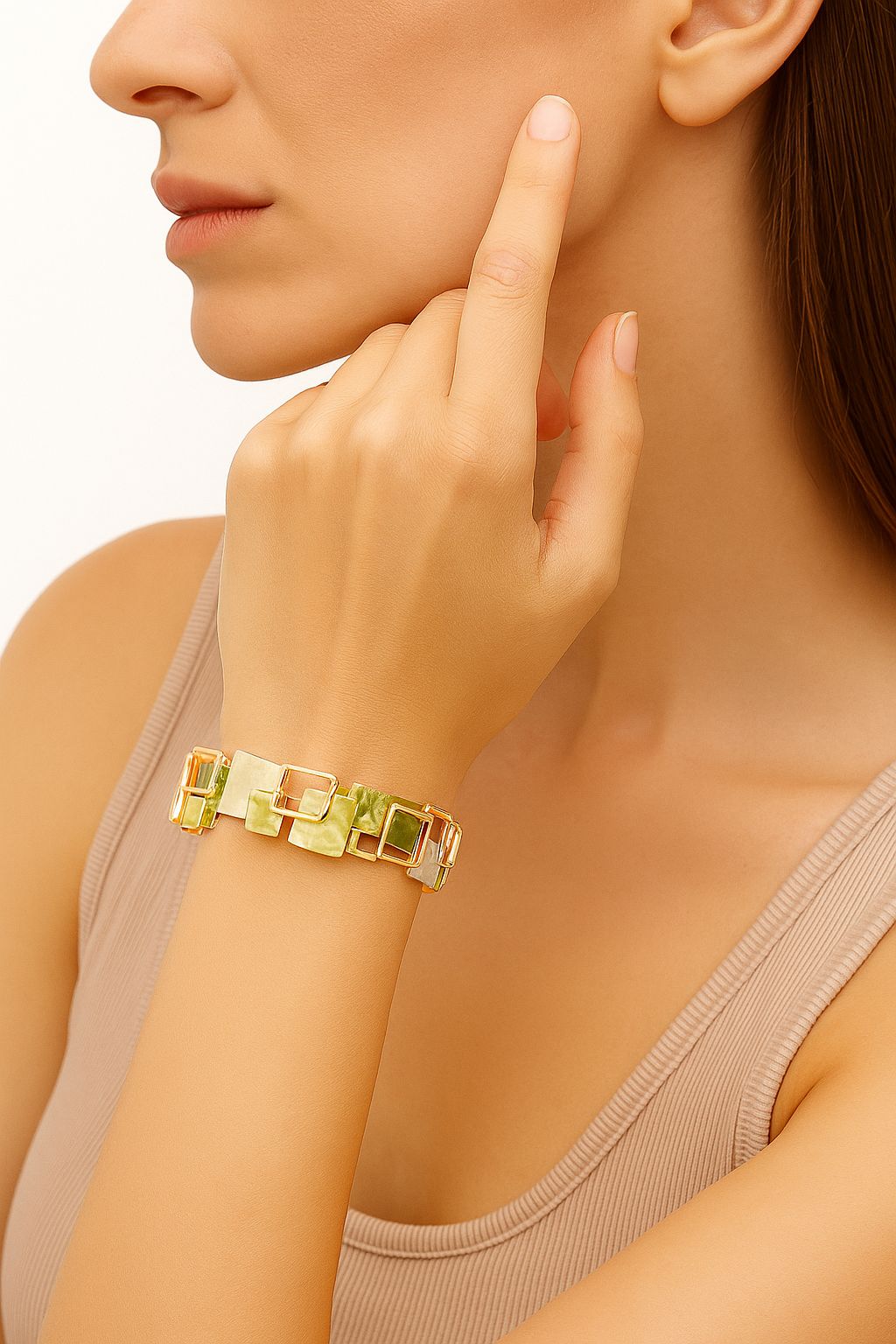 Model wearing hand-painted enamel bracelet set in KC gold with geometric design