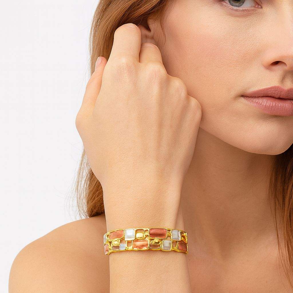 Model wearing geometric KC gold enamel bangle