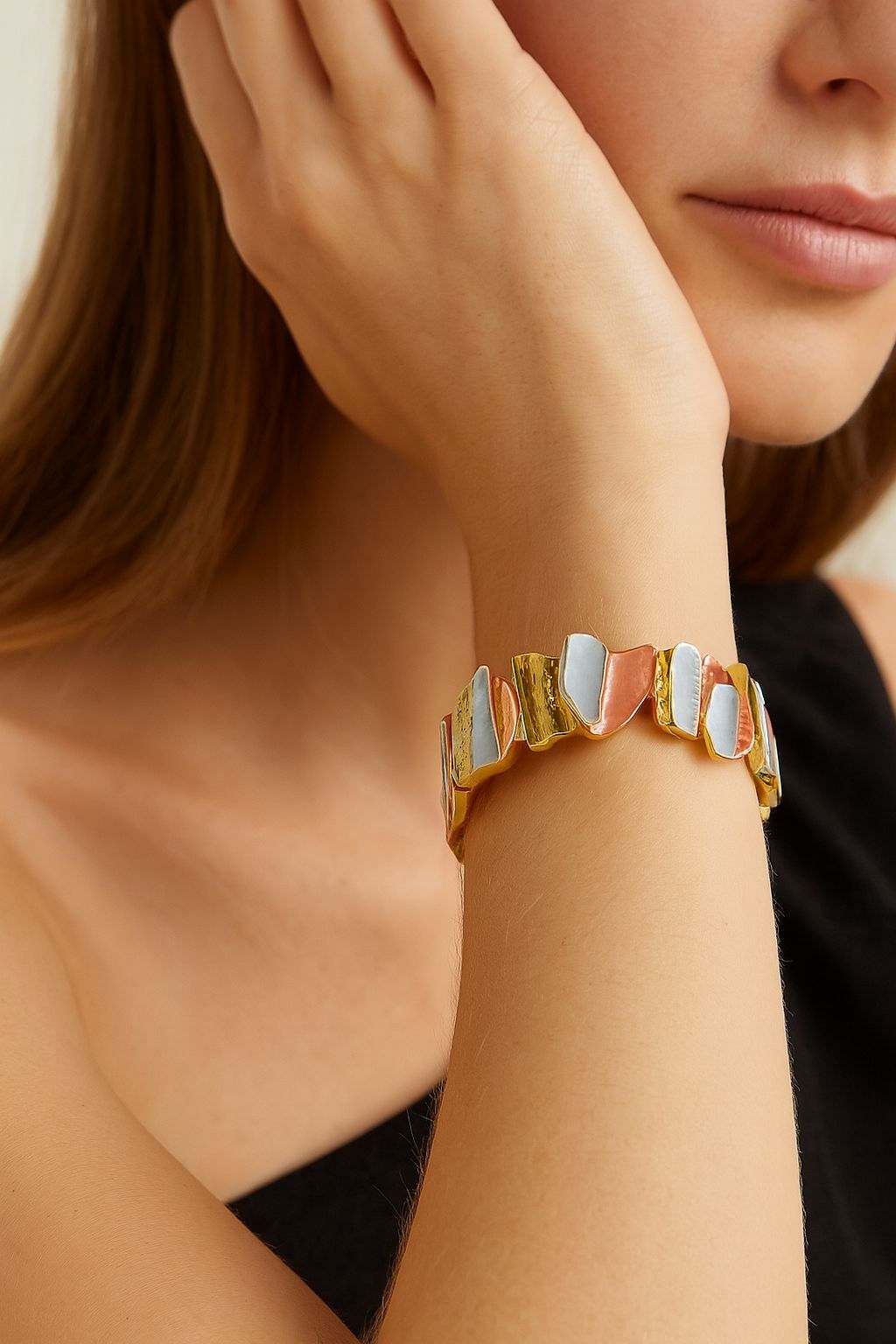 Model wearing modern KC gold plated enamel bracelet