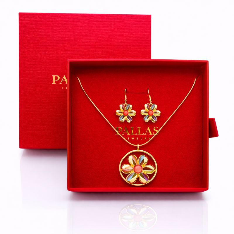 Close up of hand painted enamel pendant with textured finish