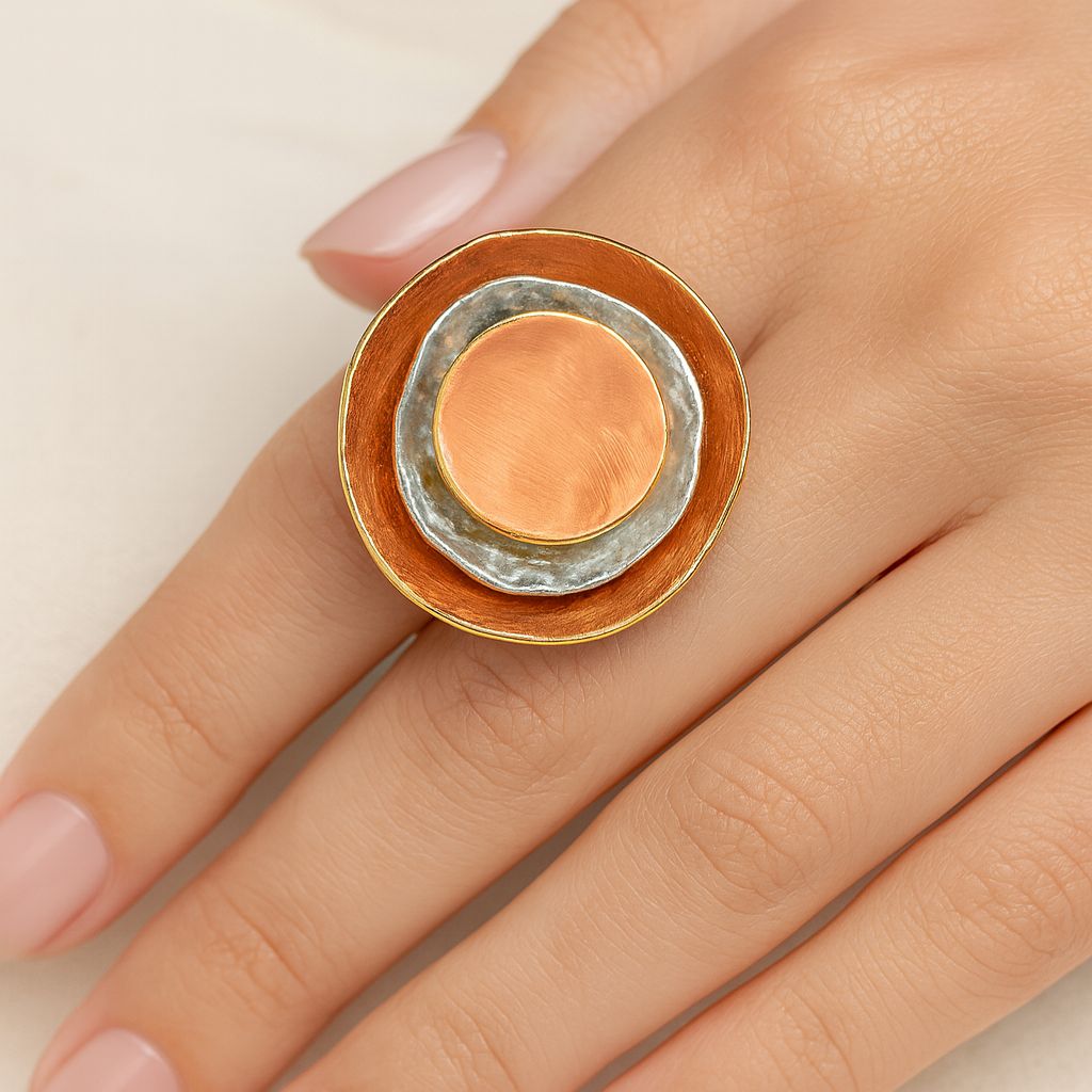 Modern artistic gold ring worn on hand model