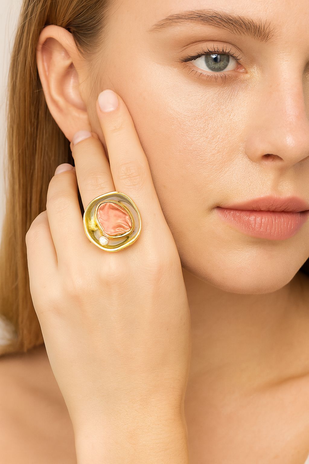 Artistic women’s ring featuring sculpted stone design