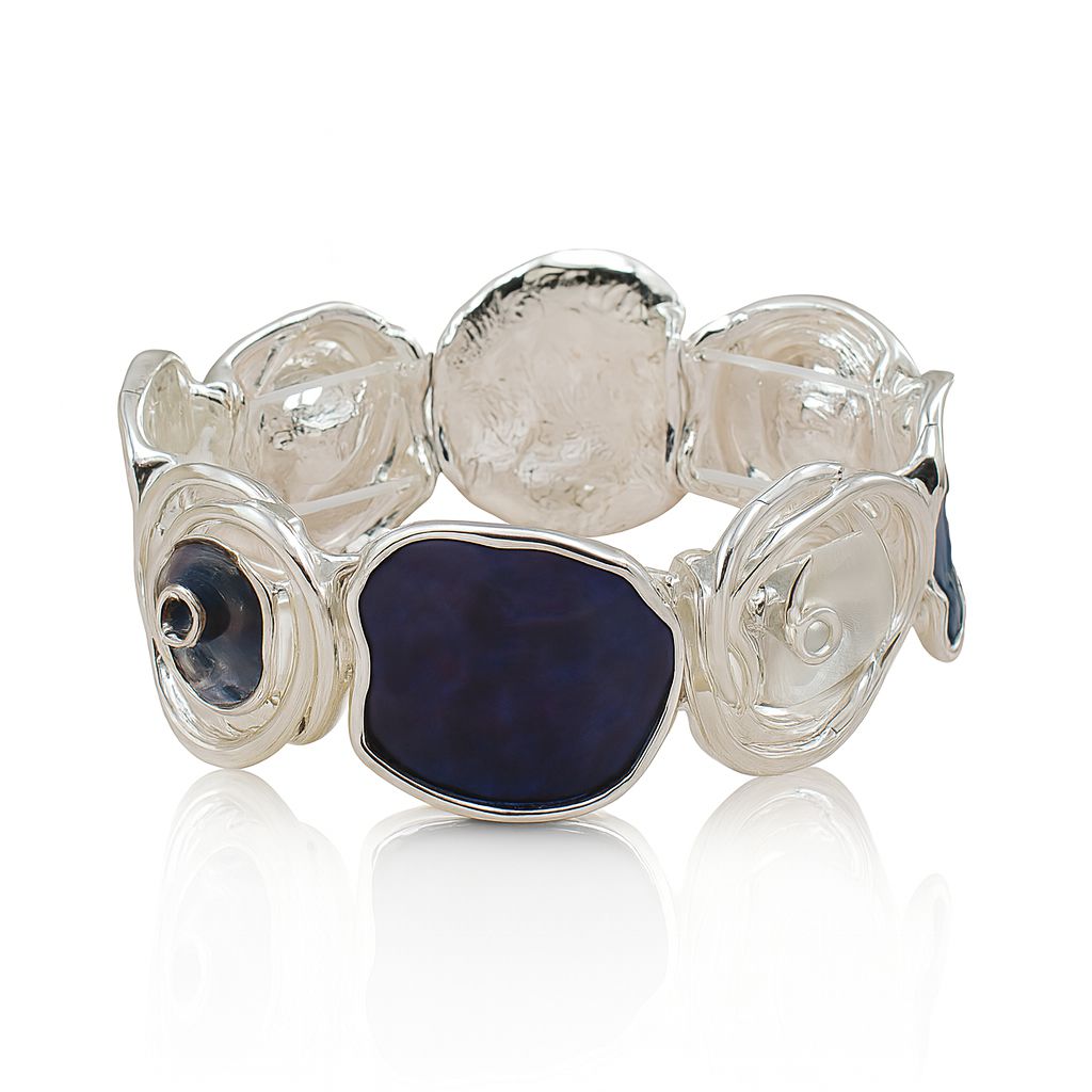 Model wearing artistic blue enamel cuff bracelet