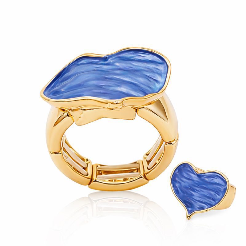 Hand painted blue enamel heart shape gold ring worn on hand