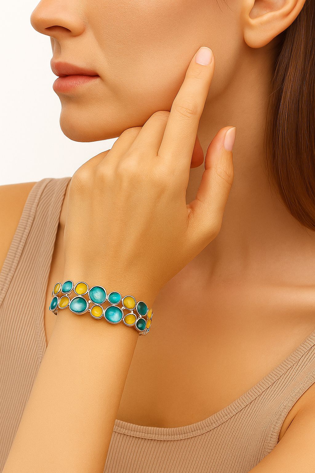 Woman wearing turquoise and yellow enamel bangle, artistic boho jewelry