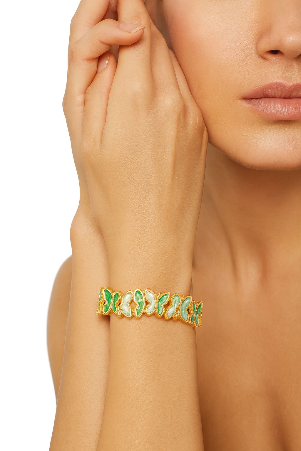 Model wearing green enamel butterfly bangle bracelet, gold plated