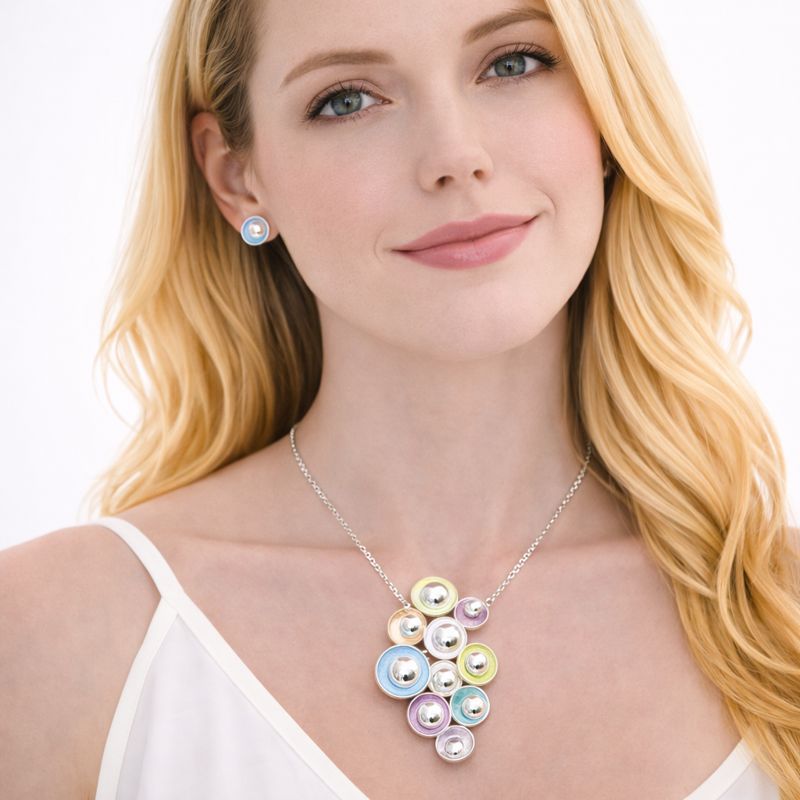 Model wearing multicolor enamel bubble necklace and matching stud earrings