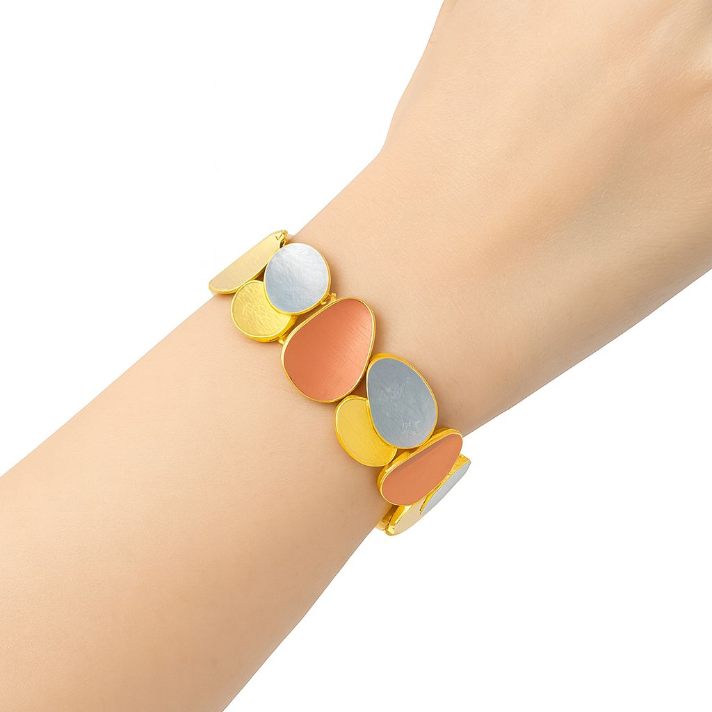 “model wearing color-block enamel KC gold bracelet on wrist”