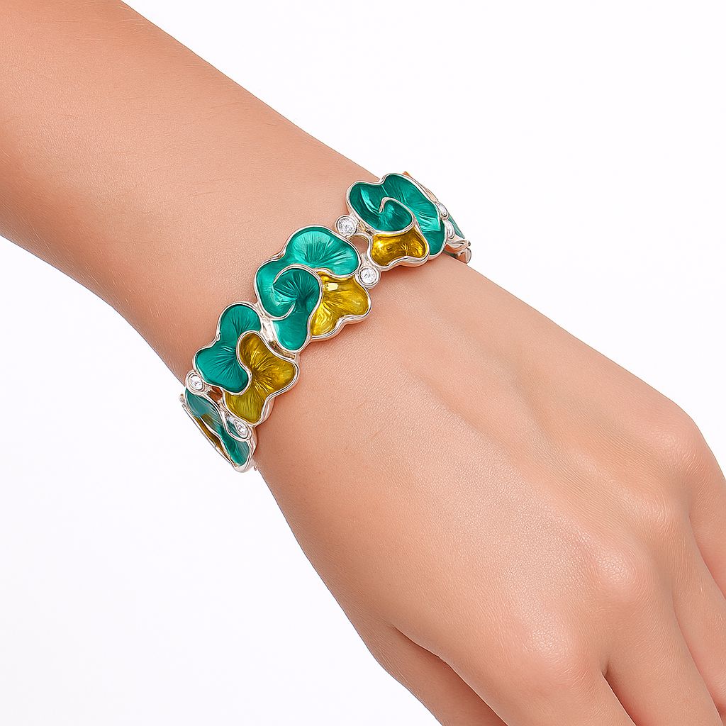 Vibrant turquoise and amber enamel petal bracelet worn on wrist.