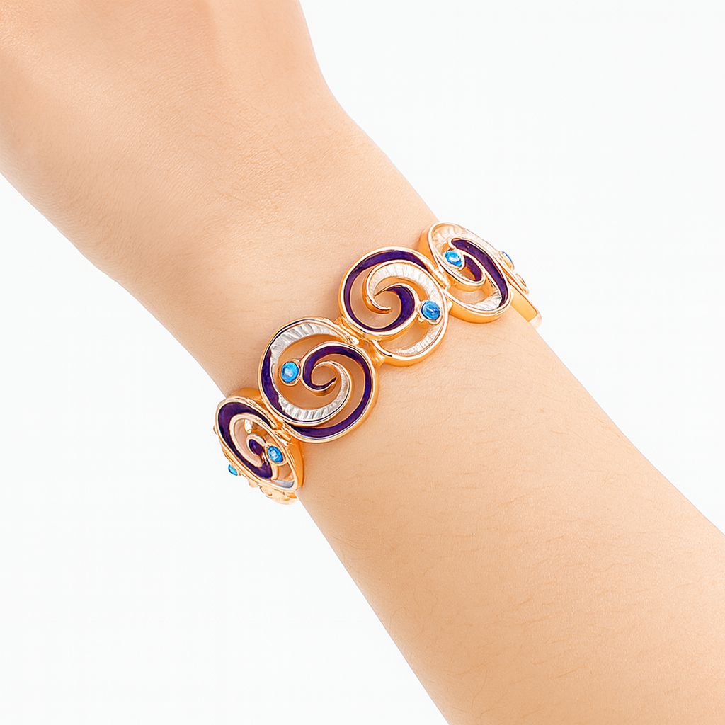 Model wearing colorful swirl statement bracelet