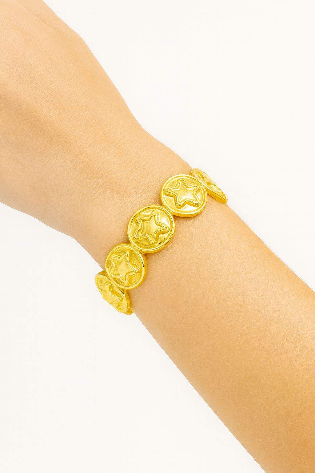 Star Embossed Gold Bracelet with KC gold plating and stretch-fit design on a wrist