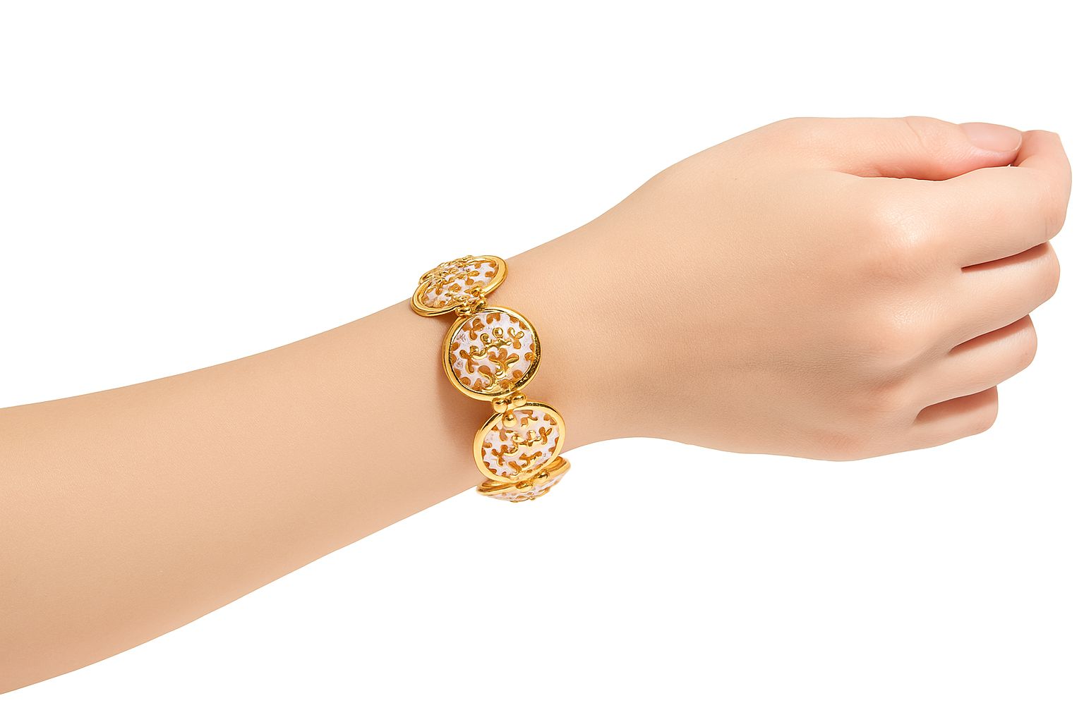 Close-up of enamel art gold bracelet on woman's wrist