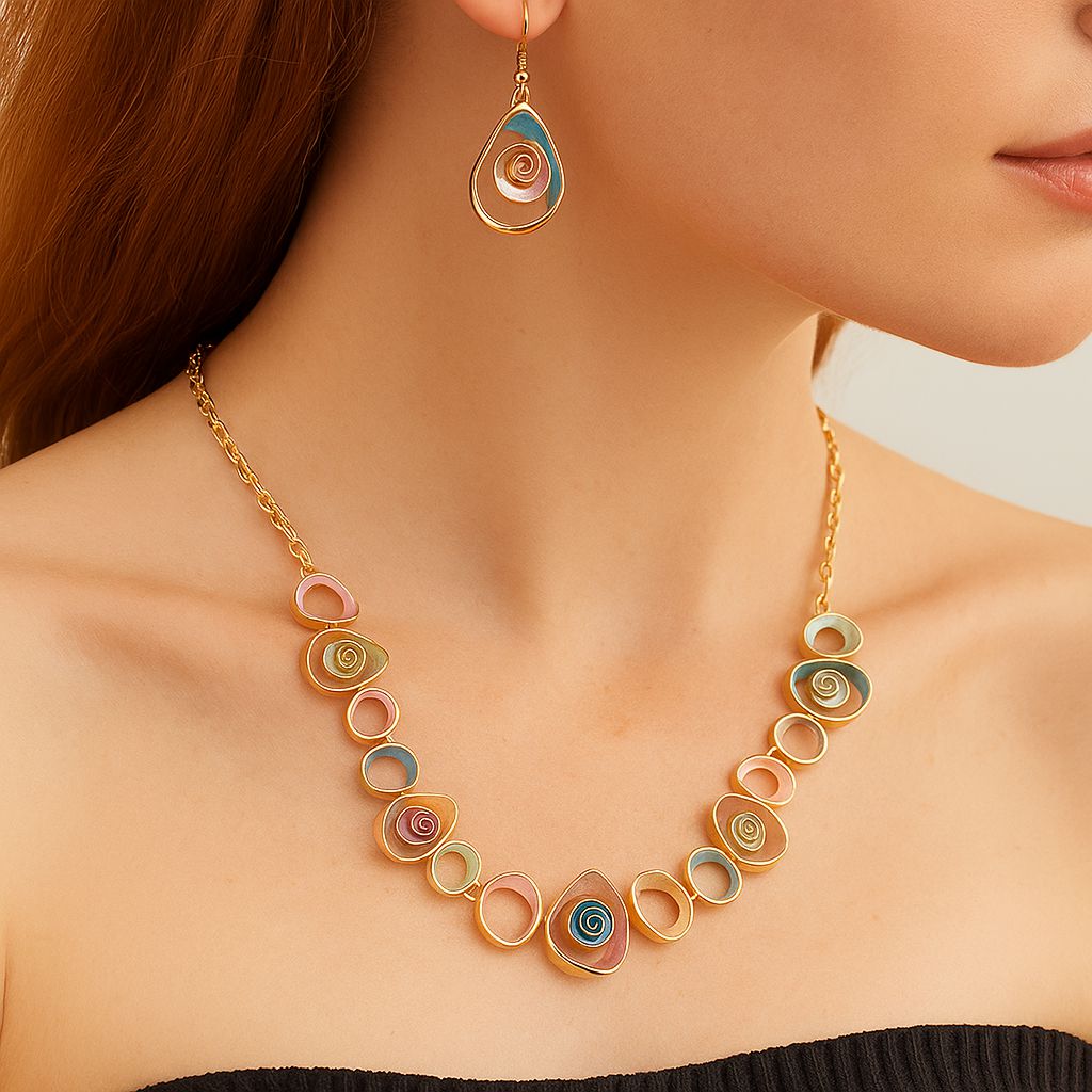 KC gold plated enamel swirl drop earrings close up view