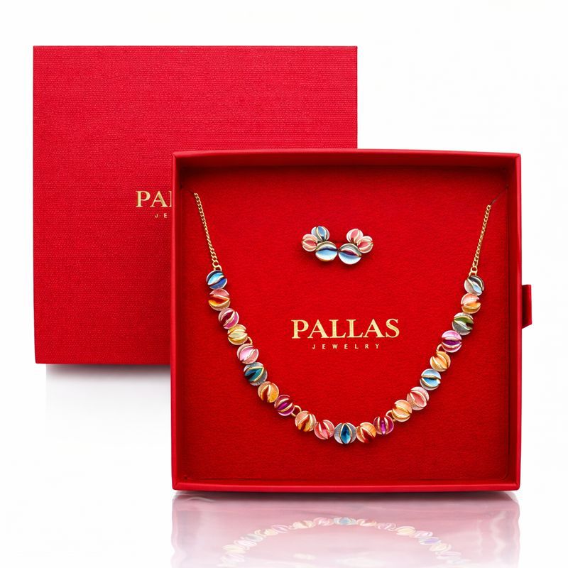 Woman wearing hand painted enamel necklace and earrings set