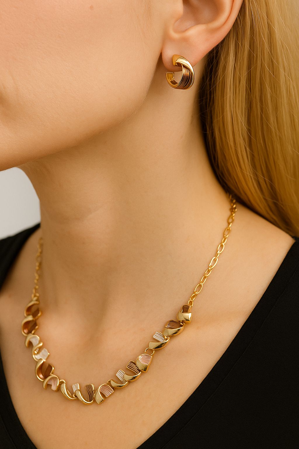 Hand painted enamel necklace and earrings set worn by model