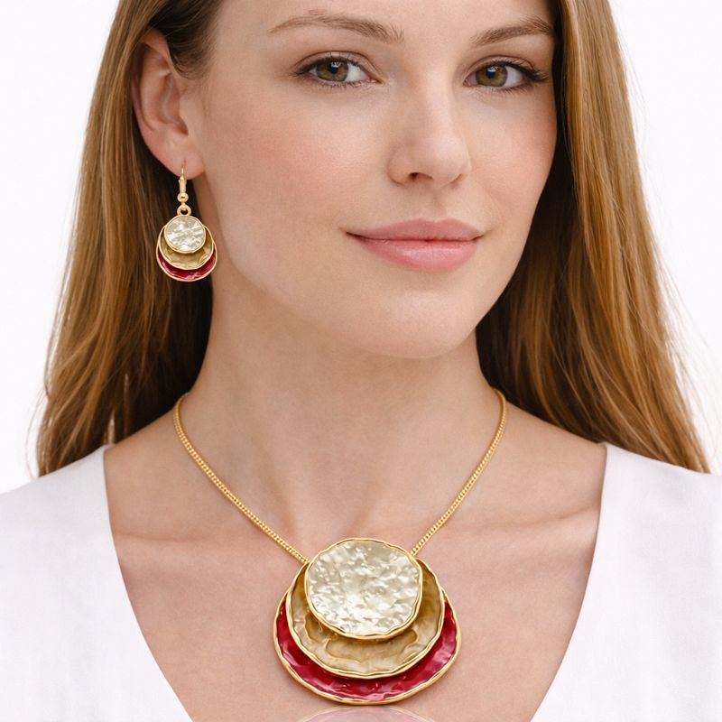 KC gold plated enamel necklace and earrings worn by model