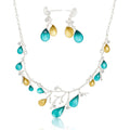 Model wearing nature inspired enamel necklace and earrings
