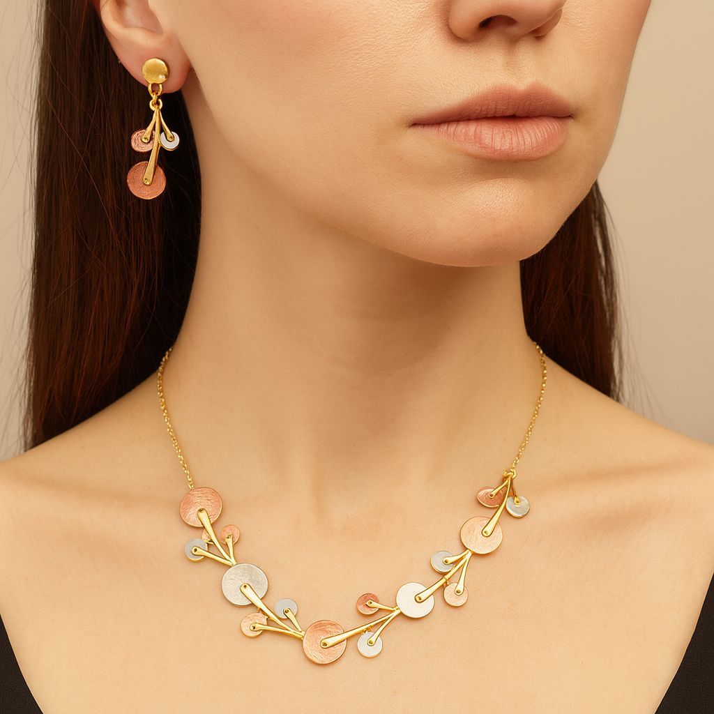 Elegant gold dangle earrings with pastel enamel accents