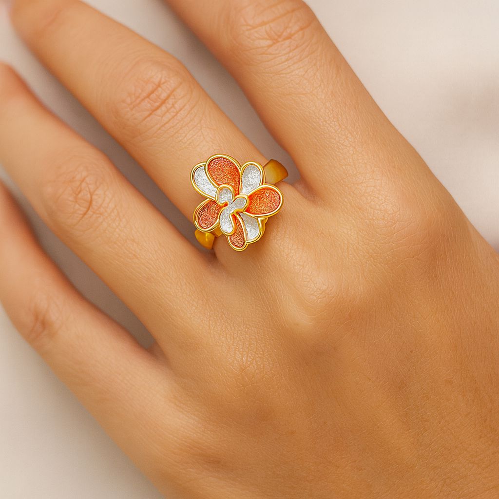 Women’s artistic enamel flower ring in KC gold worn as statement jewelry