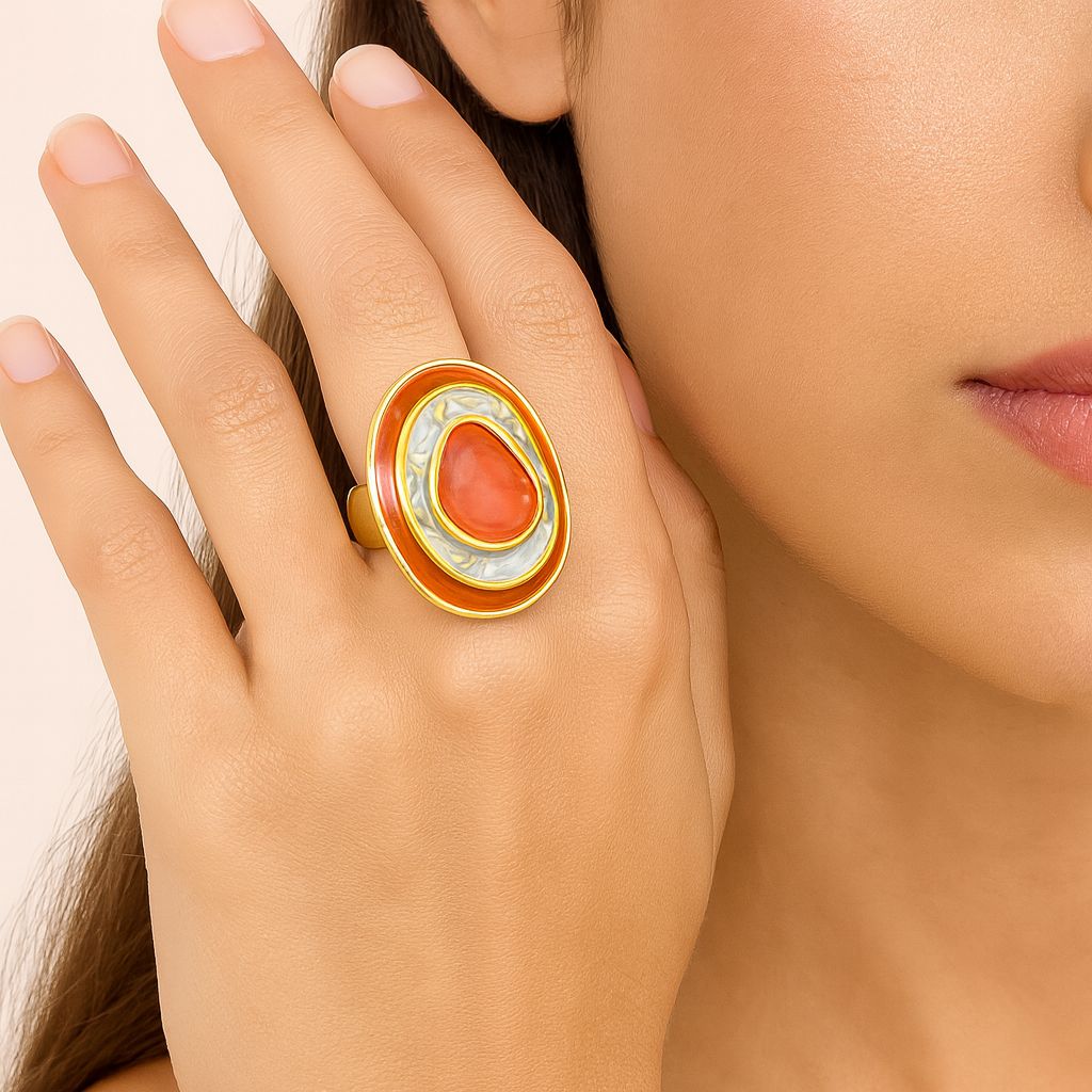 gold enamel abstract ring worn on finger close-up