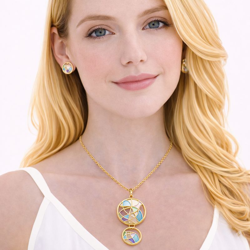 Hand painted enamel circle pendant necklace worn by model