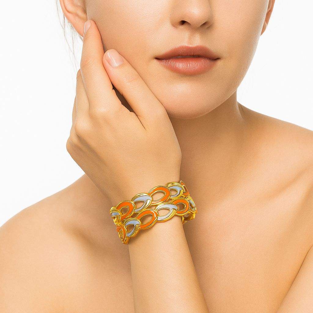 Gold enamel chain bracelet with orange and blue enamel on woman's wrist luxury jewelry by Pallas Jewelry