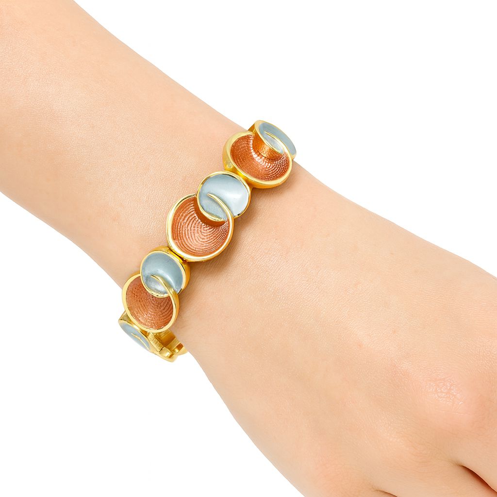 Model wearing KC gold plated artistic enamel bracelet on wrist