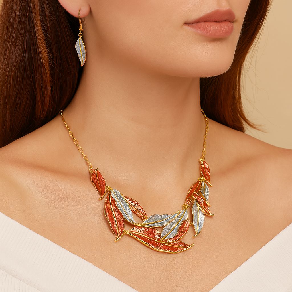 Model wearing artisan feather jewelry set in gold, silver, and copper tones
