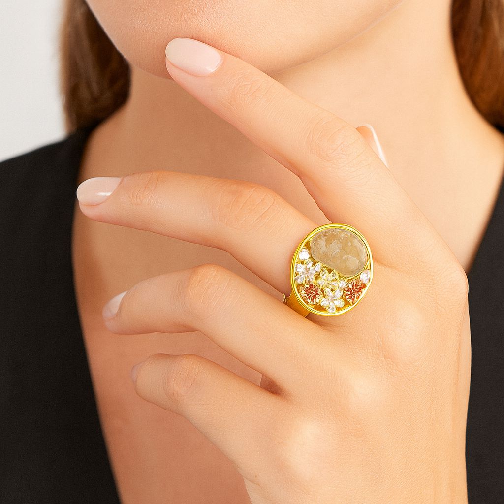 Hand-painted enamel flower cocktail ring on model hand
