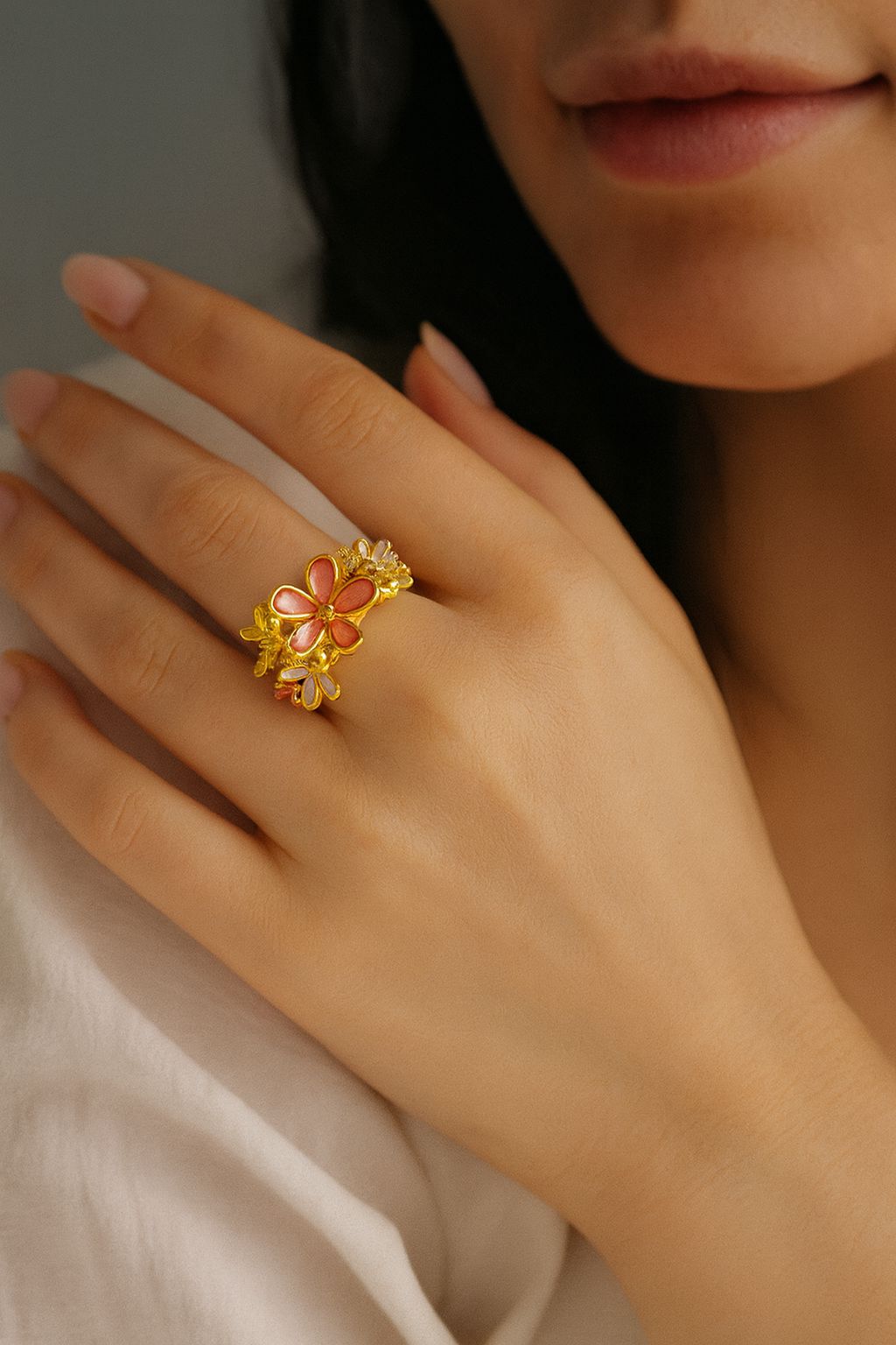 Detailed close-up of KC gold flower petal ring with enamel painting