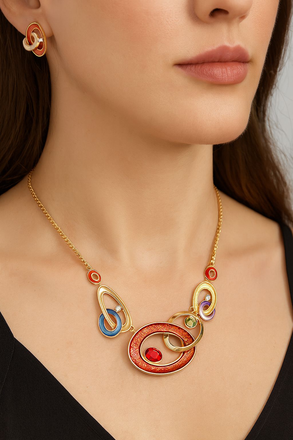 Close-up of geometric enamel earrings with KC gold plating