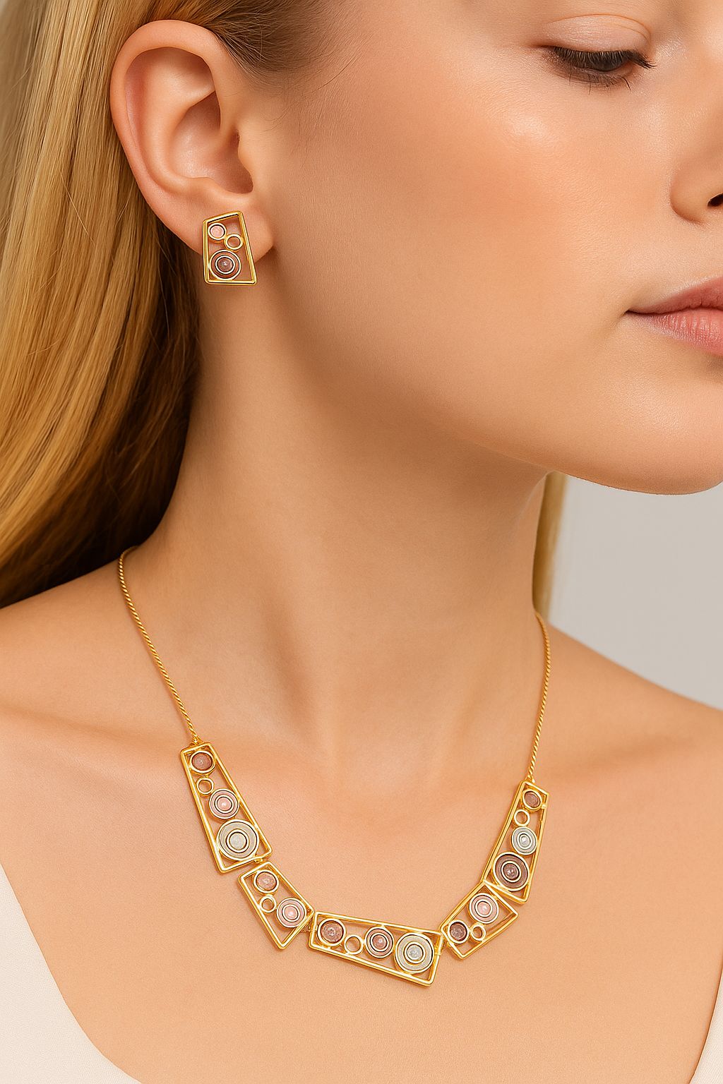 Geometric enamel earrings worn on model close up